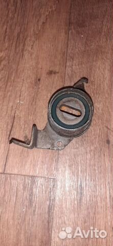 Ролик-натяжитель ремня грм Mitsubishi Carisma (DA)